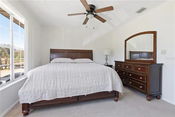 a bedroom with a bed and a dresser