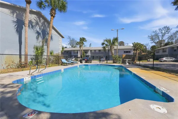 a view of a swimming pool with a patio