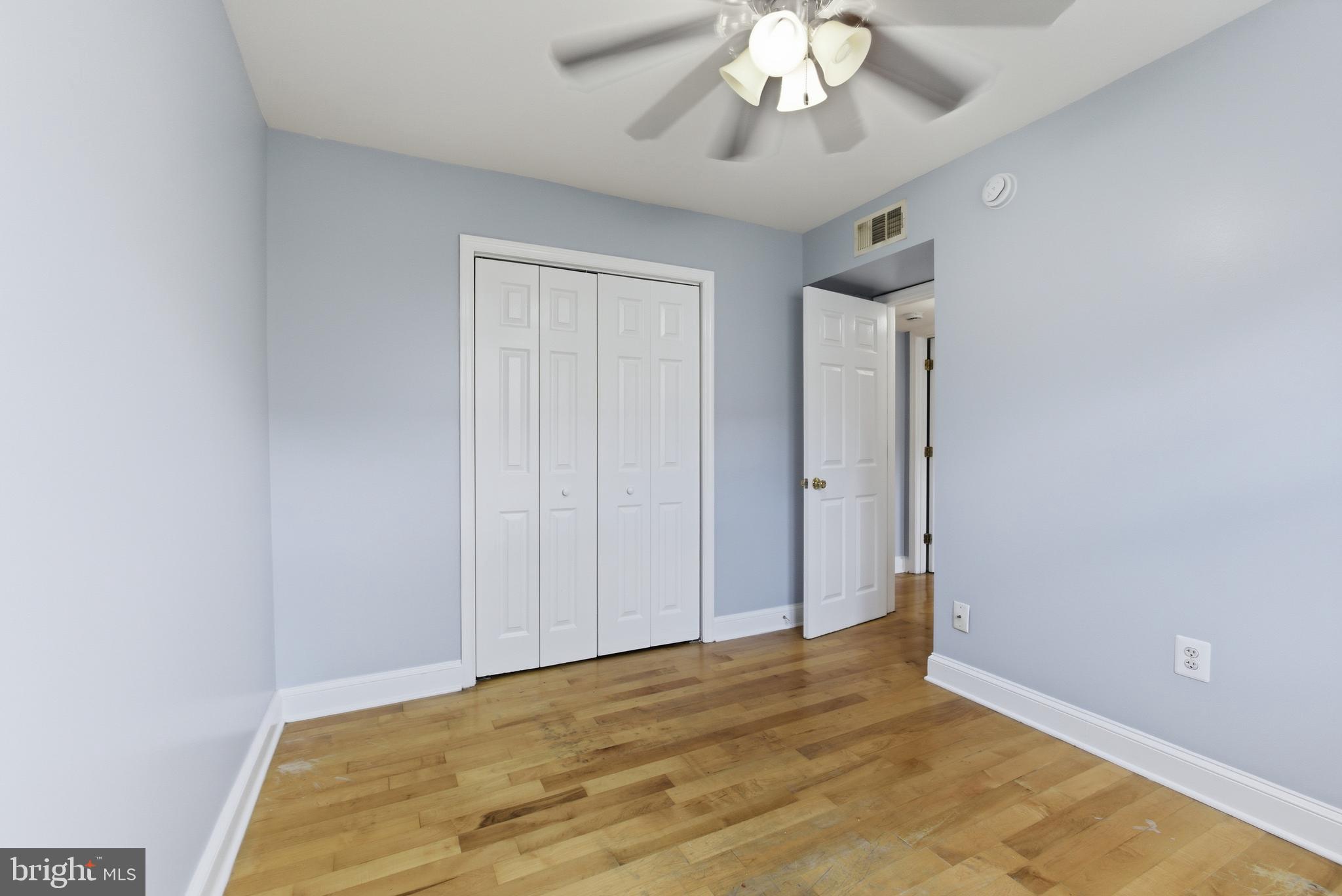 3872 9th Street Southeast, Unit 201 Washington, DC 20032 - Photo 9 of 17 a view of an empty room with a chandelier fan