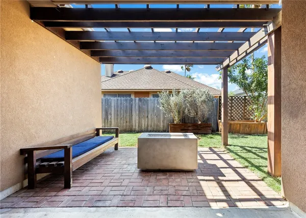 a backyard view with a seating space