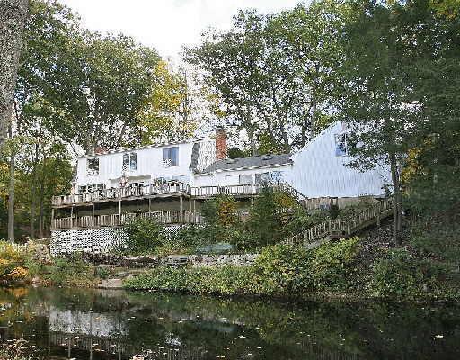 100 Valley Forge Road Weston, CT 06883 - Photo 1 of 1 a view of residential house with outdoor space and lake view