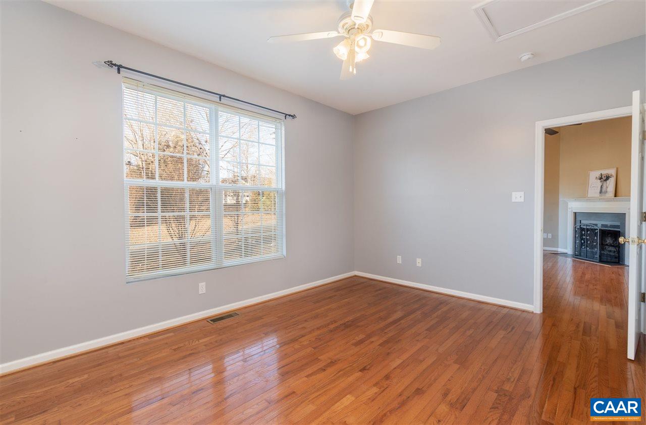 260 Geranium Road Ruckersville, VA 22968 - Photo 15 of 32 a view of an empty room with wooden floor and a window