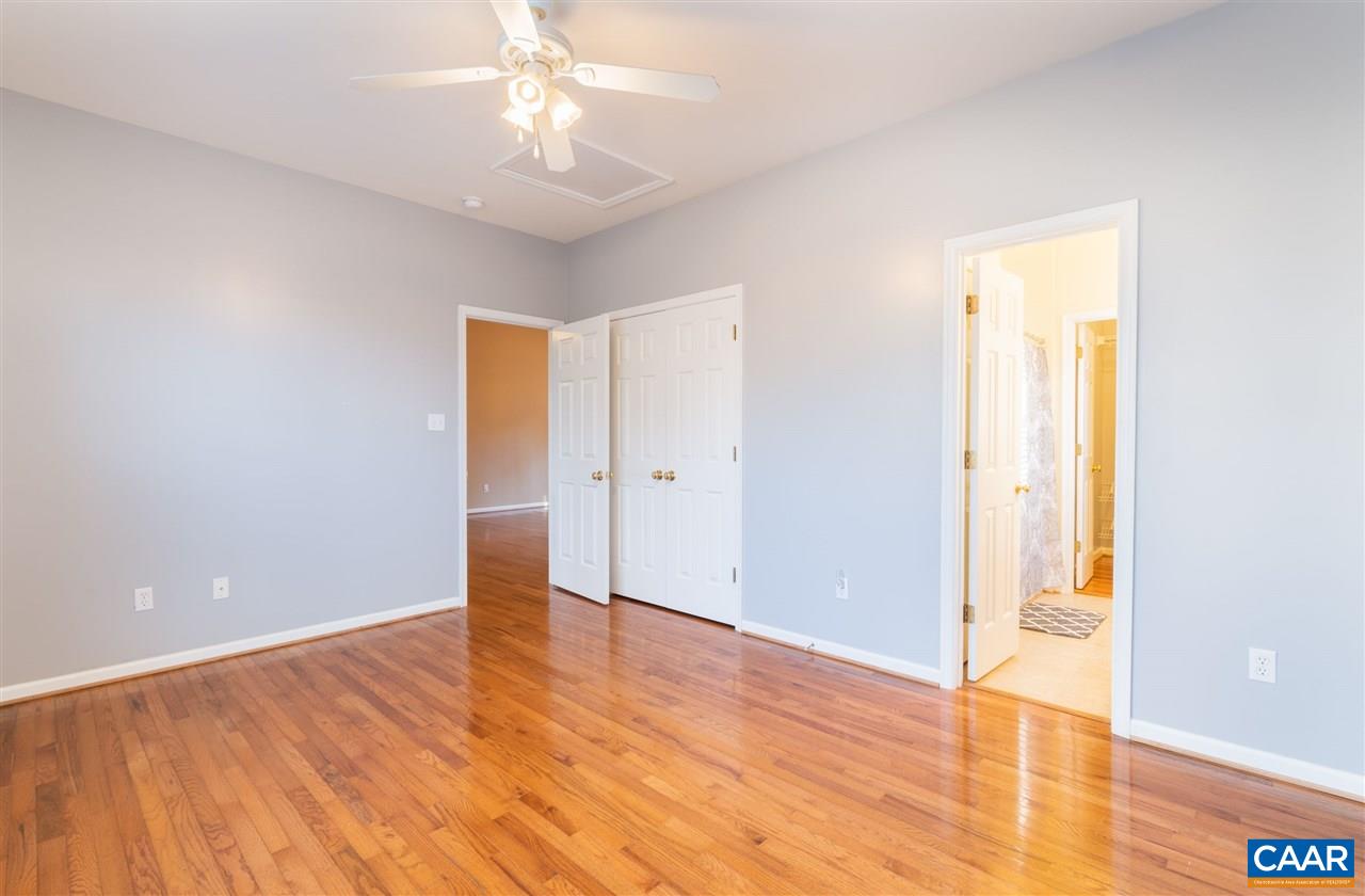 260 Geranium Road Ruckersville, VA 22968 - Photo 16 of 32 an empty room with wooden floor and windows