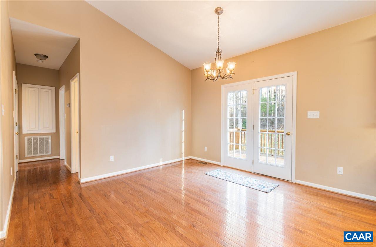 260 Geranium Road Ruckersville, VA 22968 - Photo 20 of 32 a view of an empty room with a window and wooden floor