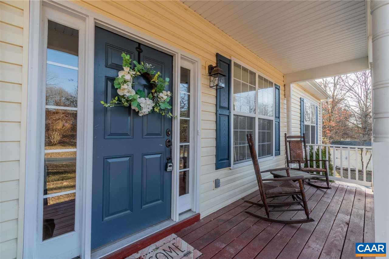 260 Geranium Road Ruckersville, VA 22968 - Photo 2 of 32 a balcony with wooden floor and outdoor seating