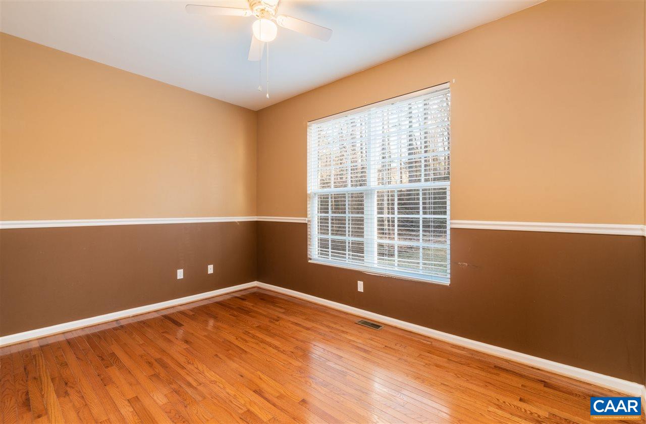 260 Geranium Road Ruckersville, VA 22968 - Photo 22 of 32 a view of an empty room with a window and wooden floor