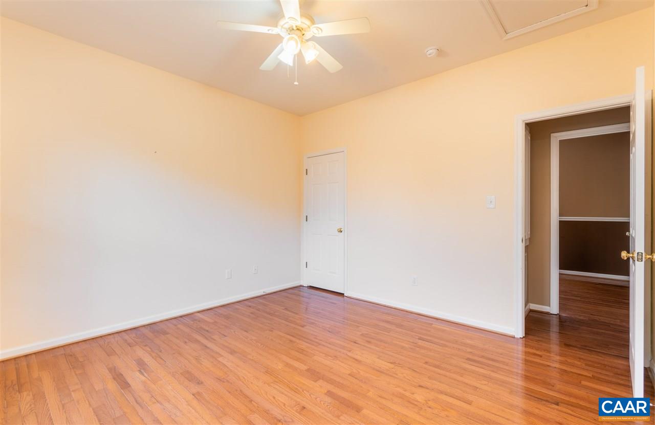 260 Geranium Road Ruckersville, VA 22968 - Photo 25 of 32 an empty room with wooden floor and fan