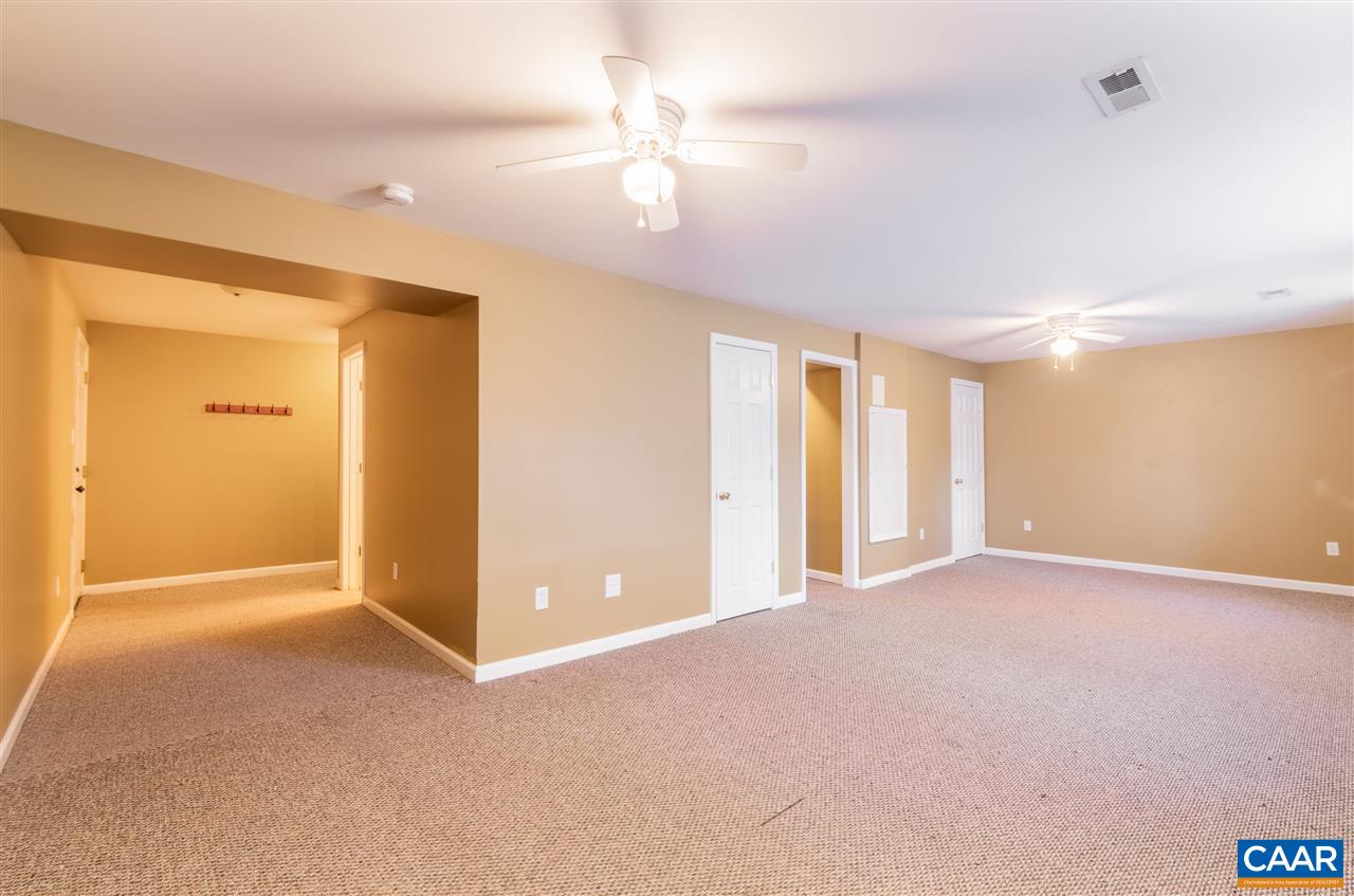 260 Geranium Road Ruckersville, VA 22968 - Photo 27 of 32 a view of an empty room with a ceiling fan