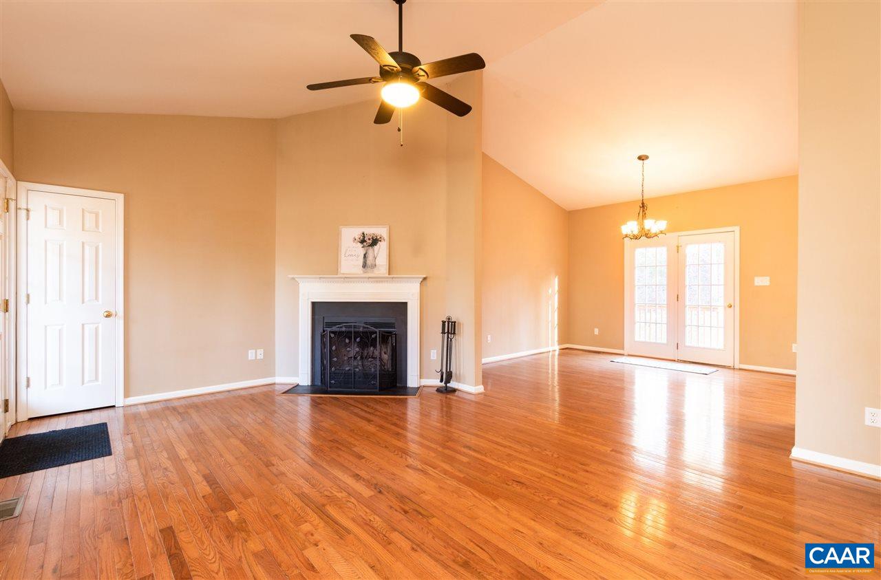 260 Geranium Road Ruckersville, VA 22968 - Photo 4 of 32 a view of empty room with wooden floor fan and window