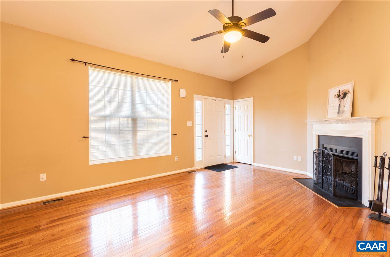 260 Geranium Road Ruckersville, VA 22968 - Photo 5 of 32 a view of an empty room with window and wooden floor