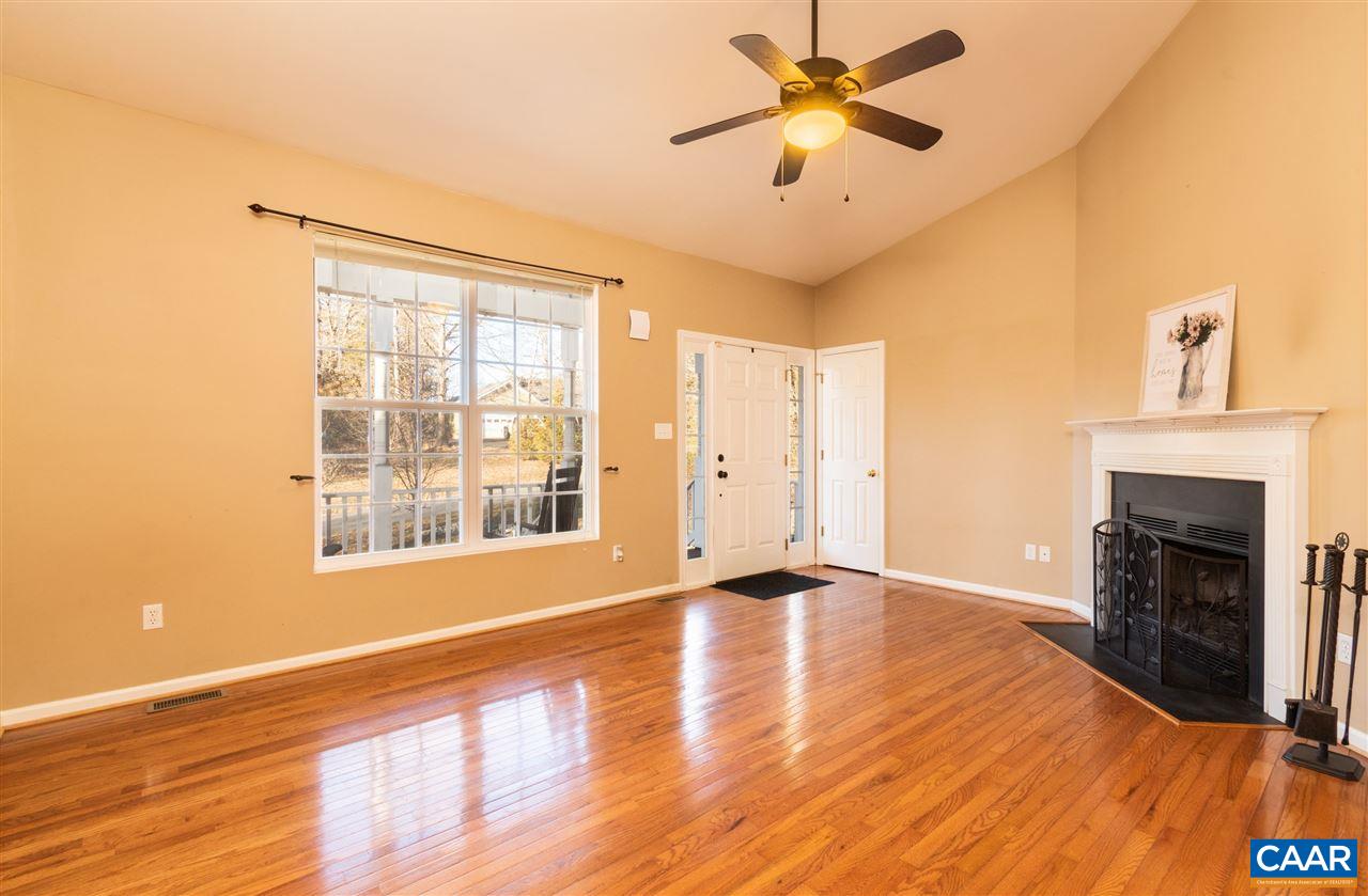 260 Geranium Road Ruckersville, VA 22968 - Photo 6 of 32 a view of an empty room with a fireplace and a window