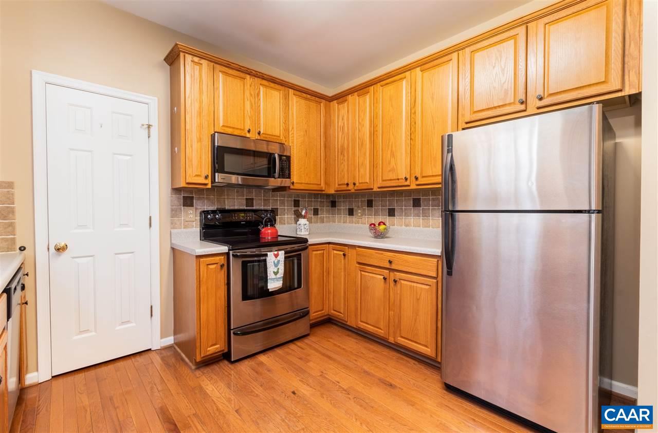 260 Geranium Road Ruckersville, VA 22968 - Photo 9 of 32 a kitchen with stainless steel appliances granite countertop a refrigerator stove top oven and sink