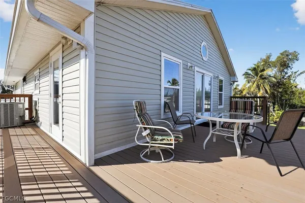 a view of a patio with couple of chairs