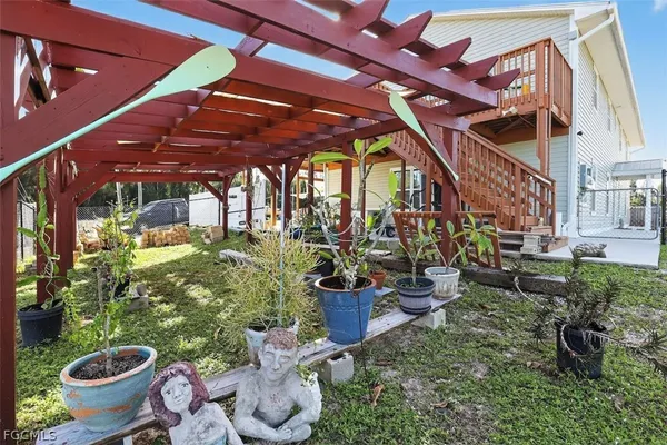 a room with lots of potted plants