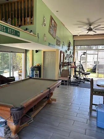 a room with gym equipment and a large window
