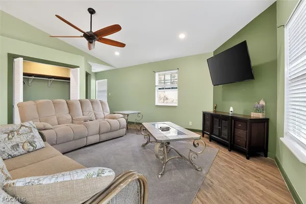 a living room with furniture and a flat screen tv