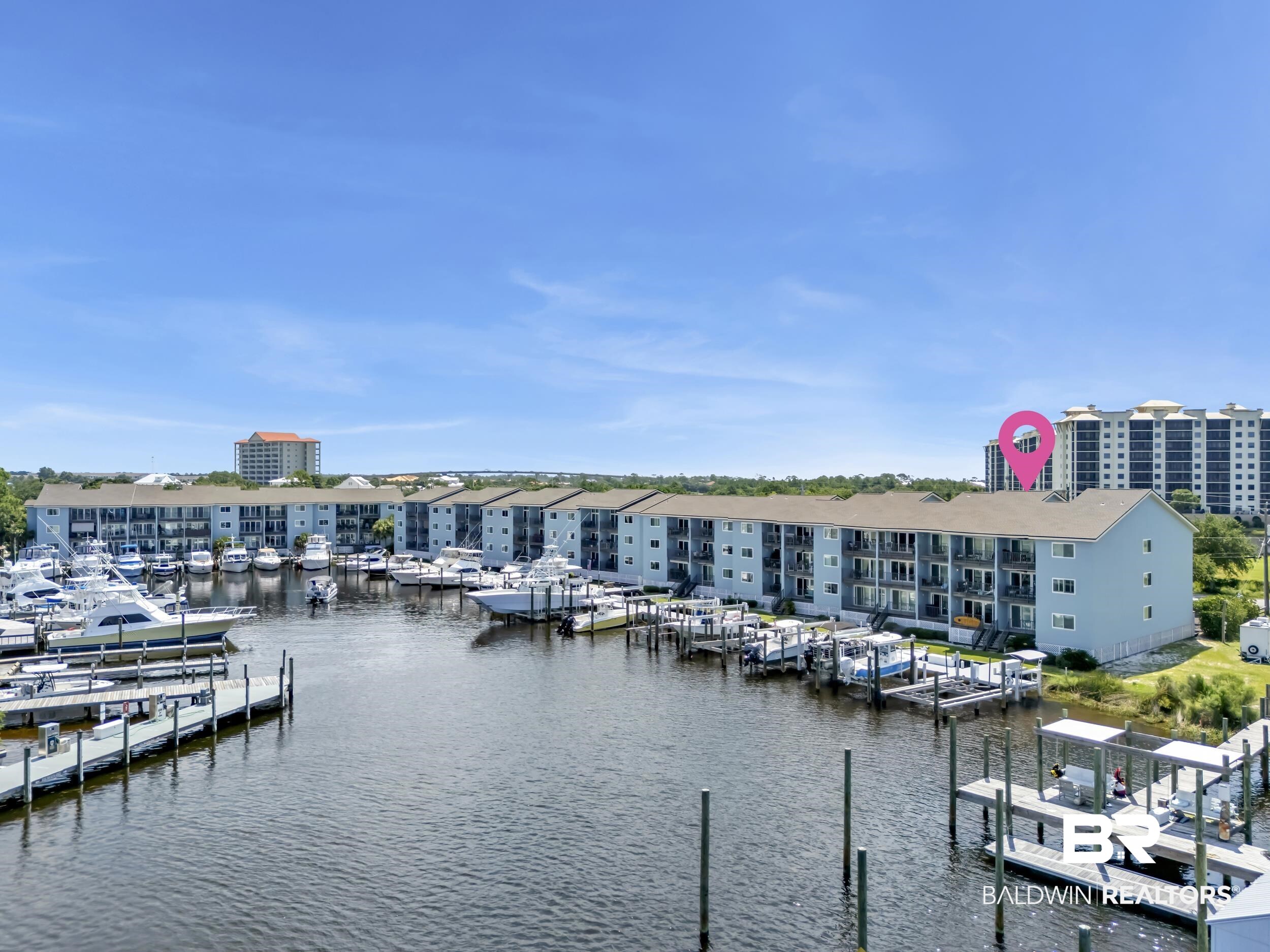 14100 River Road, Unit 211 Pensacola, FL 32507 - Photo 2 of 56 Waterfront condominium complex featuring a multi-slip marina