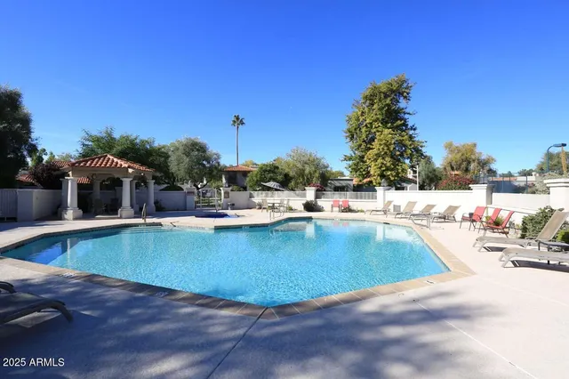 a view of a swimming pool with a patio