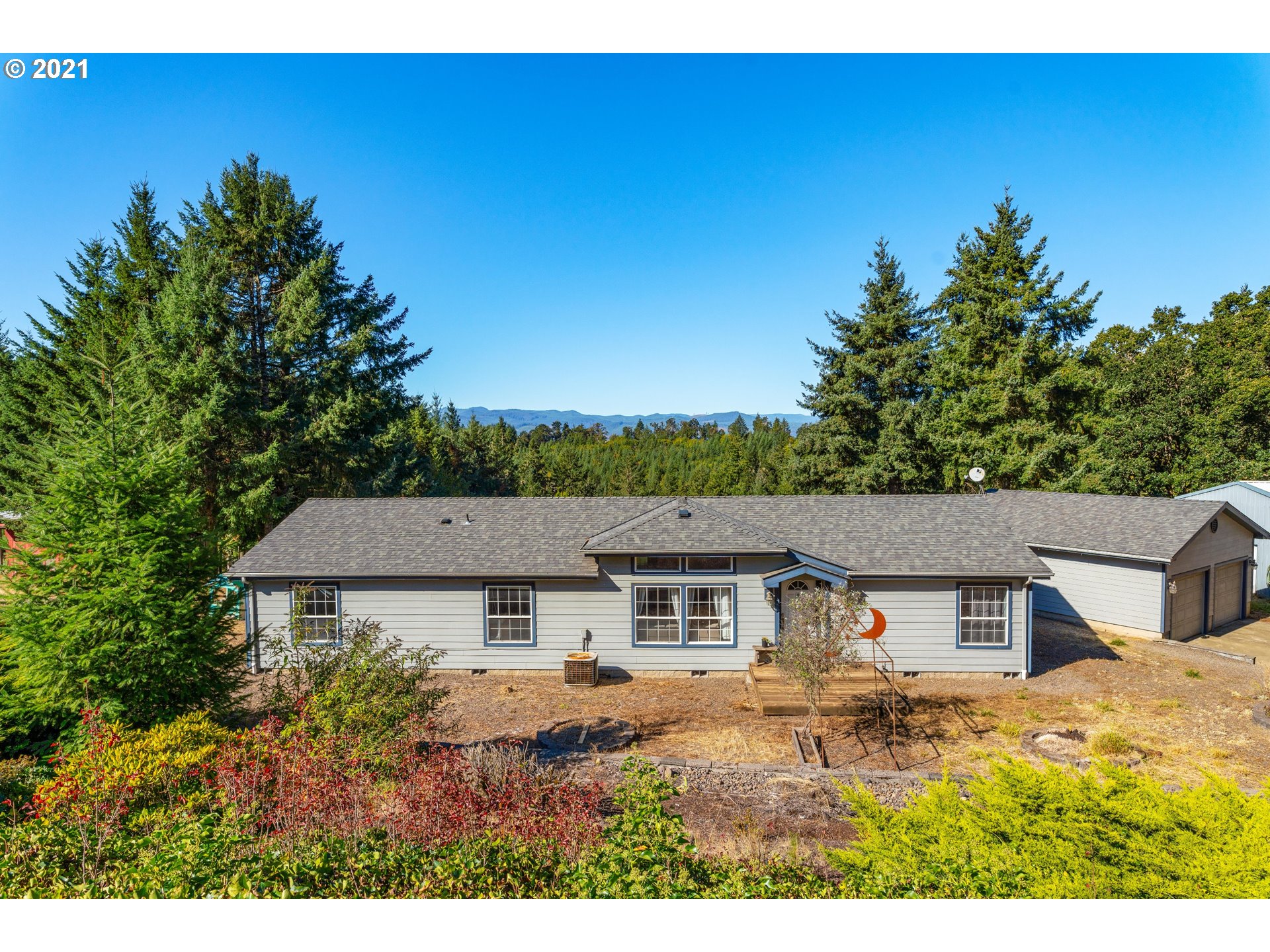 15010 Ferns Corner Road Dallas, OR 97338 - Photo 1 of 32 an aerial view of residential houses with outdoor space and trees