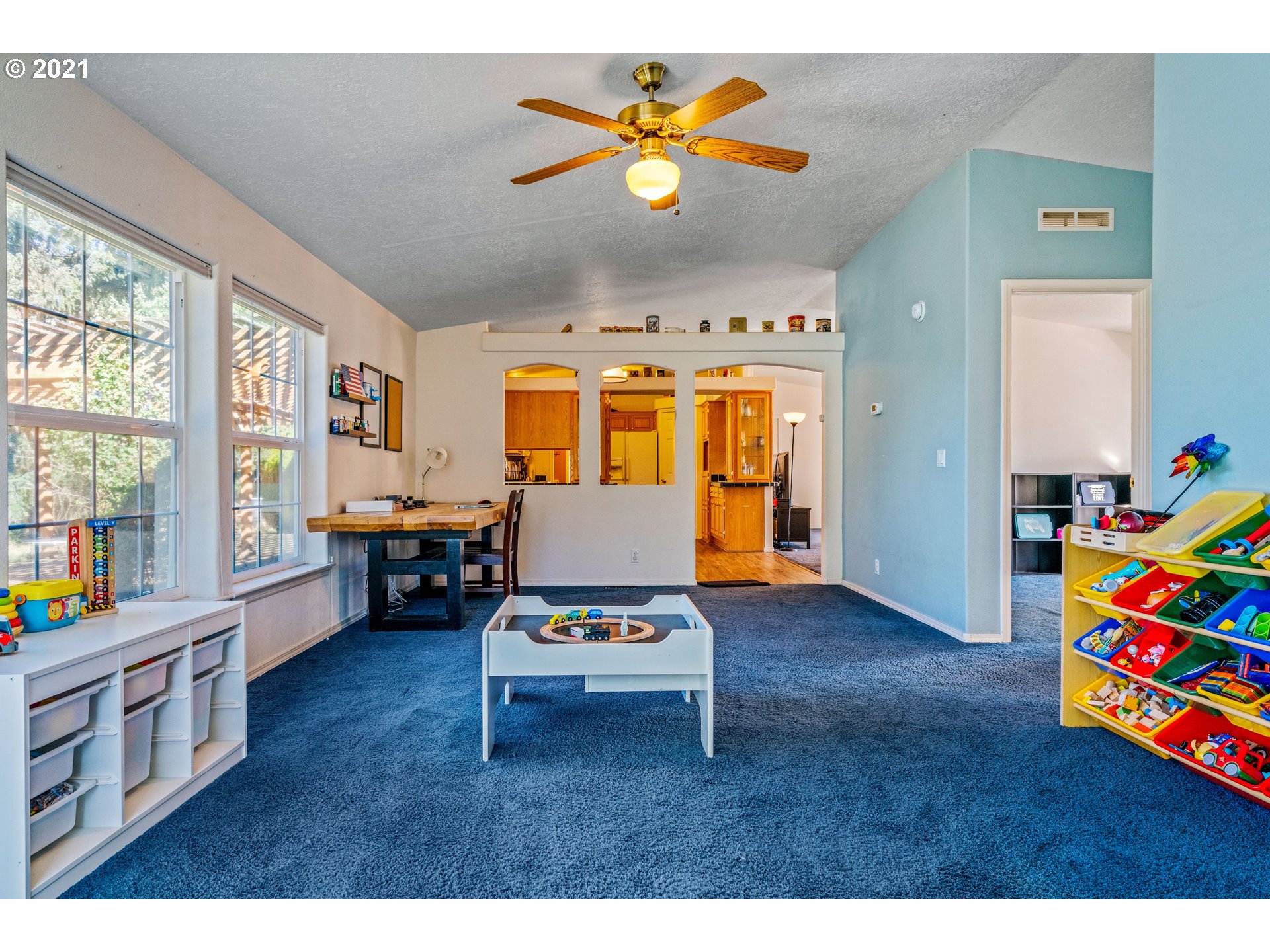 15010 Ferns Corner Road Dallas, OR 97338 - Photo 16 of 32 a living room with furniture and paintings on the wall