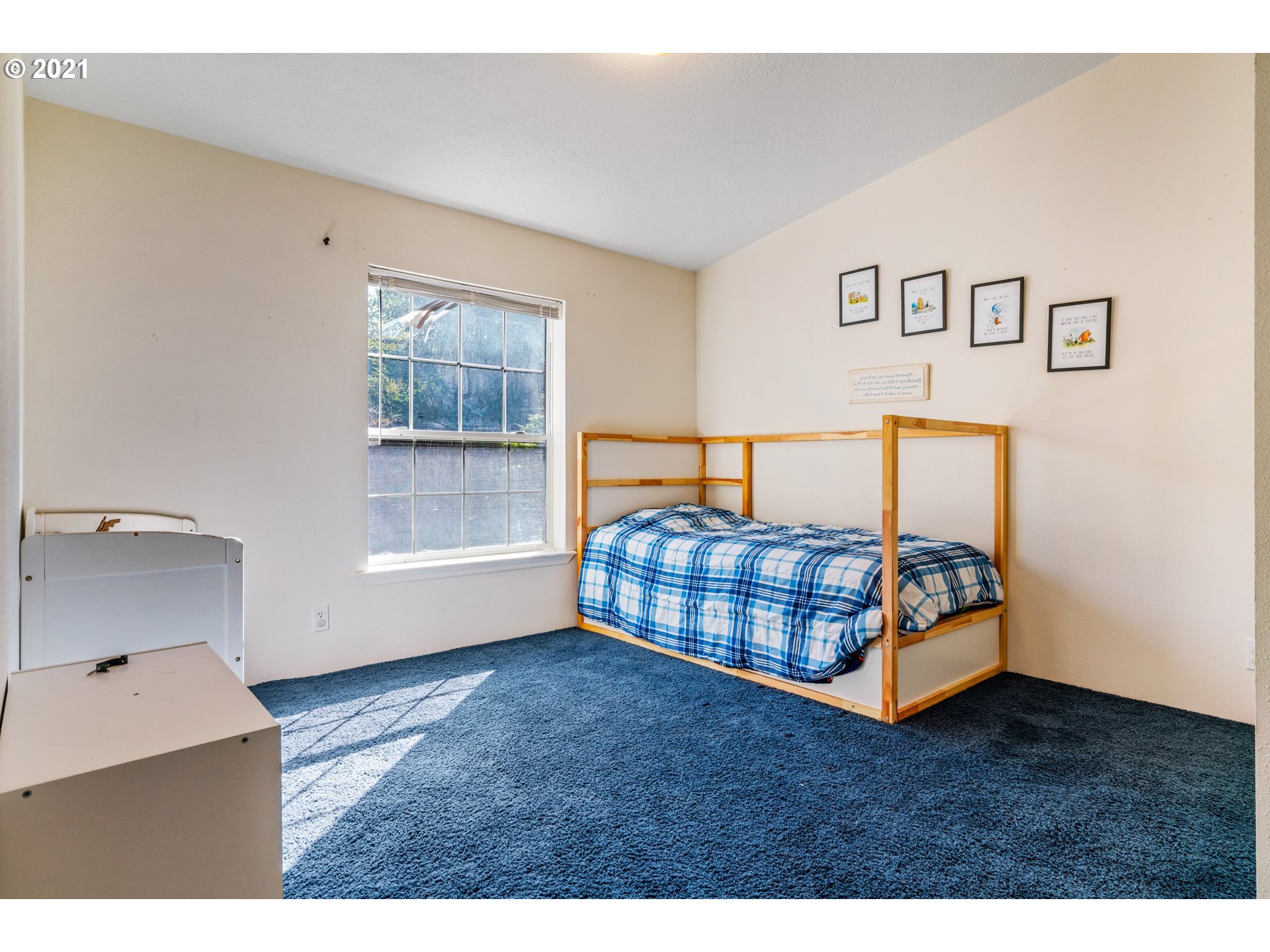 15010 Ferns Corner Road Dallas, OR 97338 - Photo 20 of 32 a bedroom with a bed and wooden floor