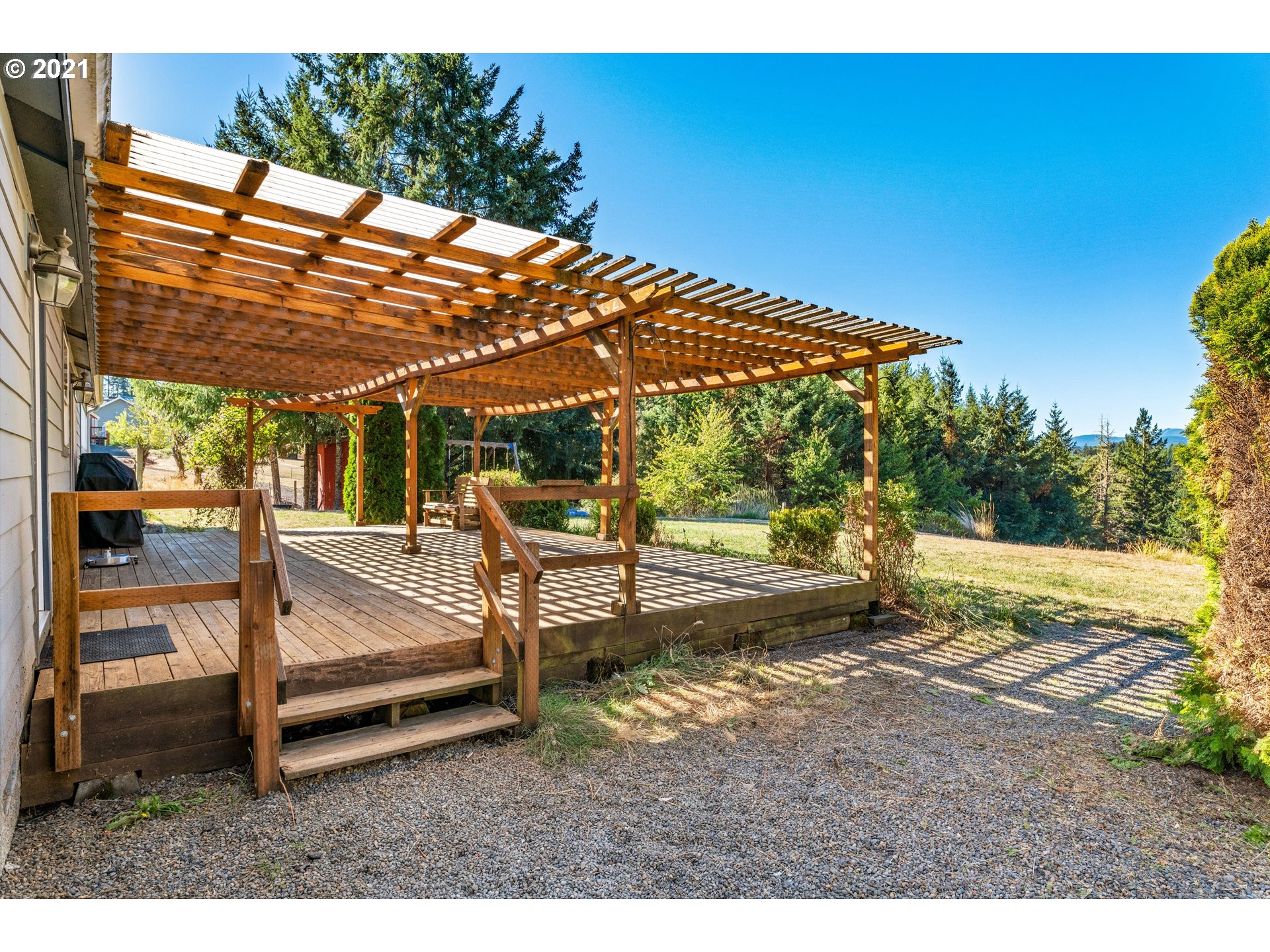 15010 Ferns Corner Road Dallas, OR 97338 - Photo 26 of 32 a backyard of a house with table and chairs