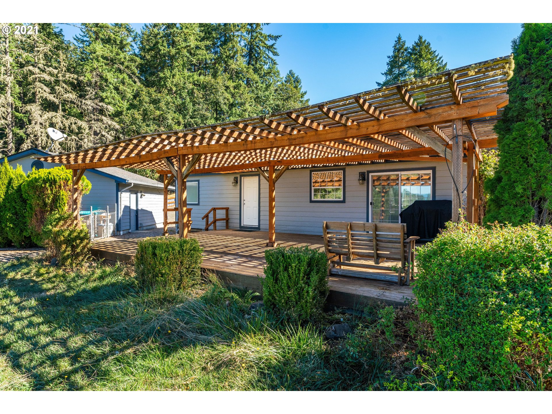 15010 Ferns Corner Road Dallas, OR 97338 - Photo 27 of 32 a front view of a house with a garden