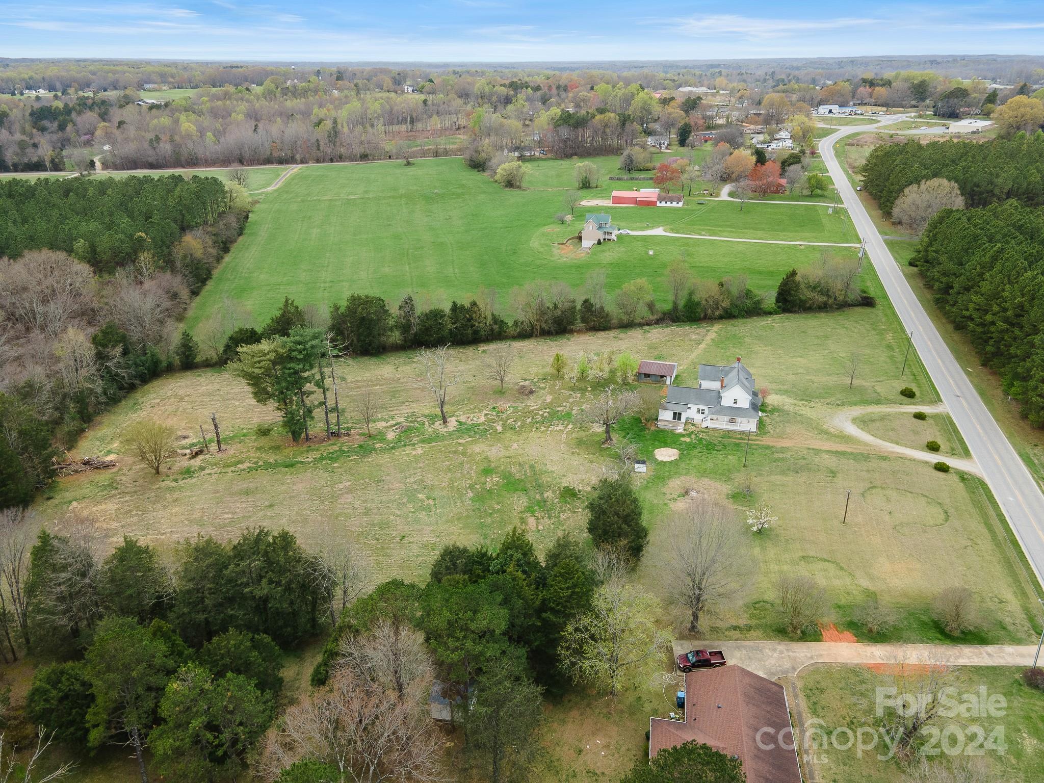 8375 Woodleaf Road Woodleaf, NC 27054 - Photo 34 of 35 an aerial view of a house with a yard