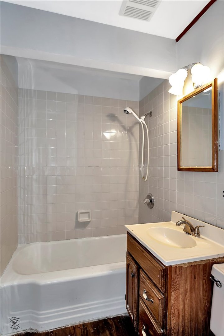 14301 Kilpatrick Avenue Midlothian, IL 60445 - Photo 11 of 22 a bathroom with a sink and a mirror