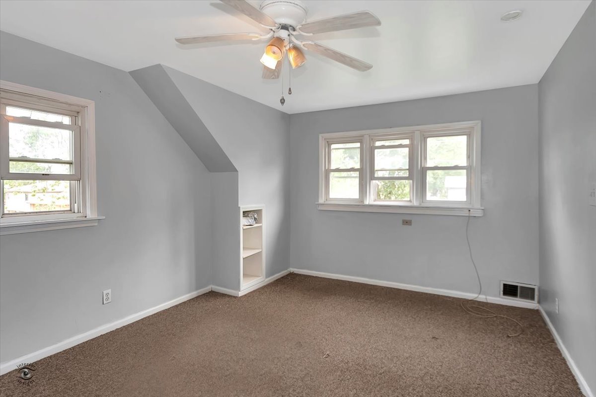 14301 Kilpatrick Avenue Midlothian, IL 60445 - Photo 14 of 22 a view of an empty room with a window