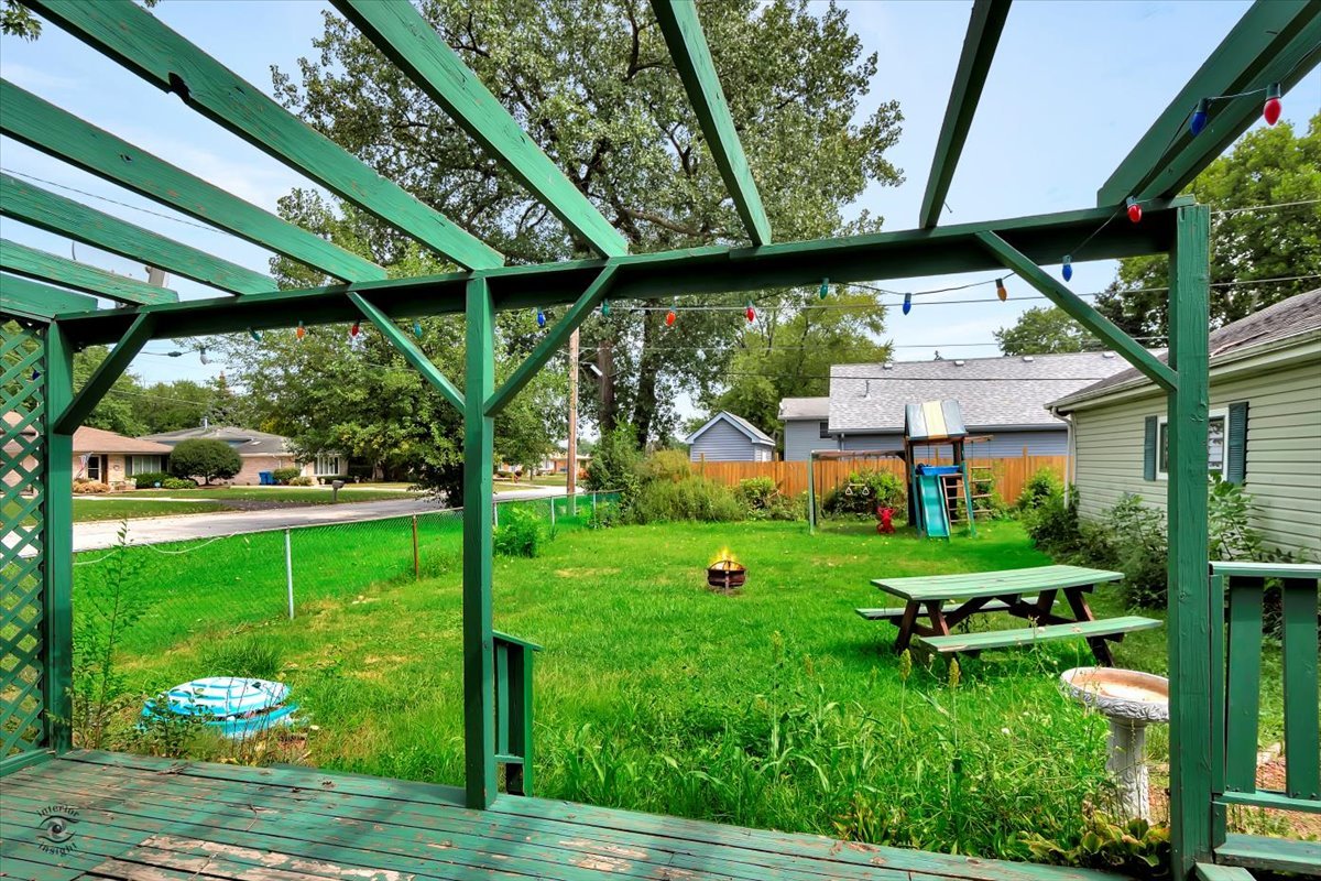 14301 Kilpatrick Avenue Midlothian, IL 60445 - Photo 18 of 22 a view of backyard with plants and outdoor seating