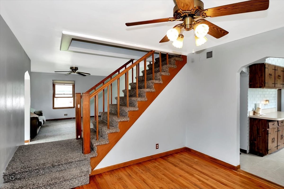 14301 Kilpatrick Avenue Midlothian, IL 60445 - Photo 3 of 22 a view of hallway with stairs and wooden floor