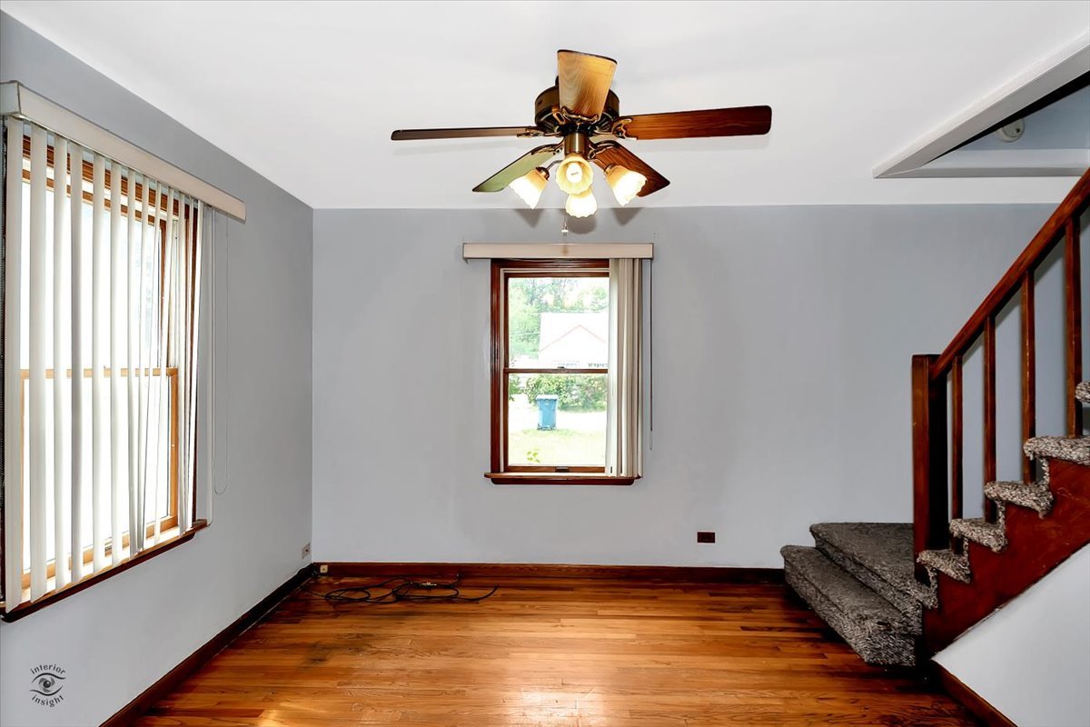 14301 Kilpatrick Avenue Midlothian, IL 60445 - Photo 4 of 22 a view of an empty room with window and ceiling fan