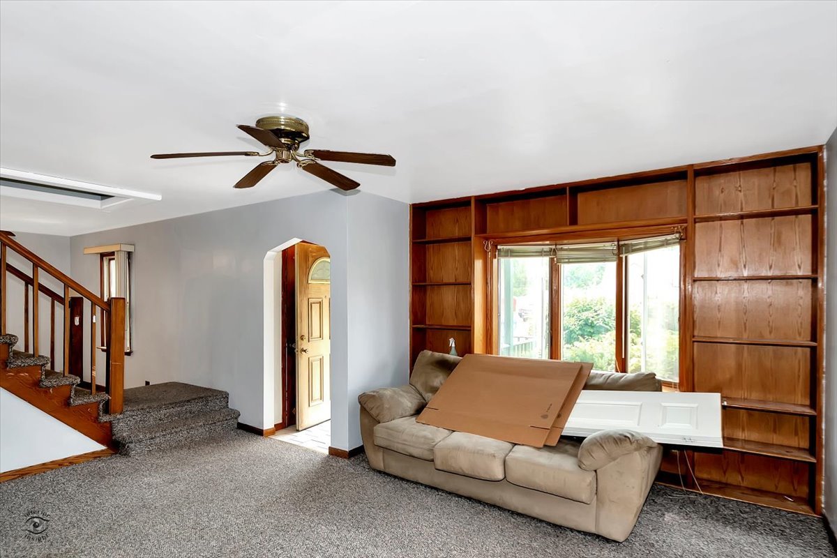 14301 Kilpatrick Avenue Midlothian, IL 60445 - Photo 5 of 22 a living room with furniture and a window