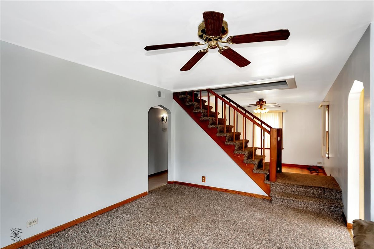 14301 Kilpatrick Avenue Midlothian, IL 60445 - Photo 6 of 22 a view of staircase with railing and white walls