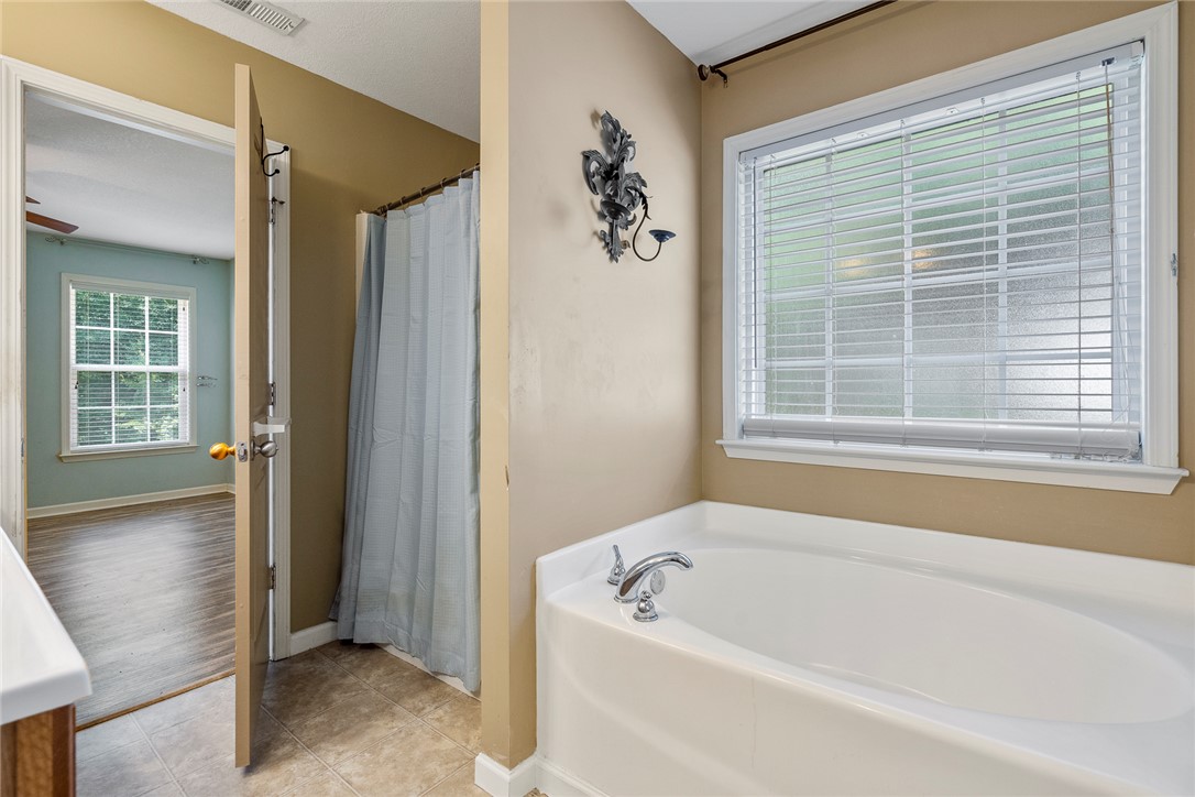 167 Mediterranean Avenue Anderson, SC 29621 - Photo 21 of 33 Relax in a soaking tub beneath a privacy-enabled window.