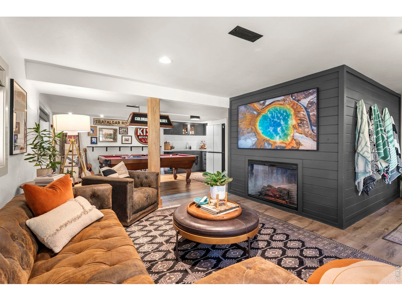 770 North Cedar Brook Road Boulder, CO 80304 - Photo 29 of 50 Lower level hangout with gaming space and fireplace