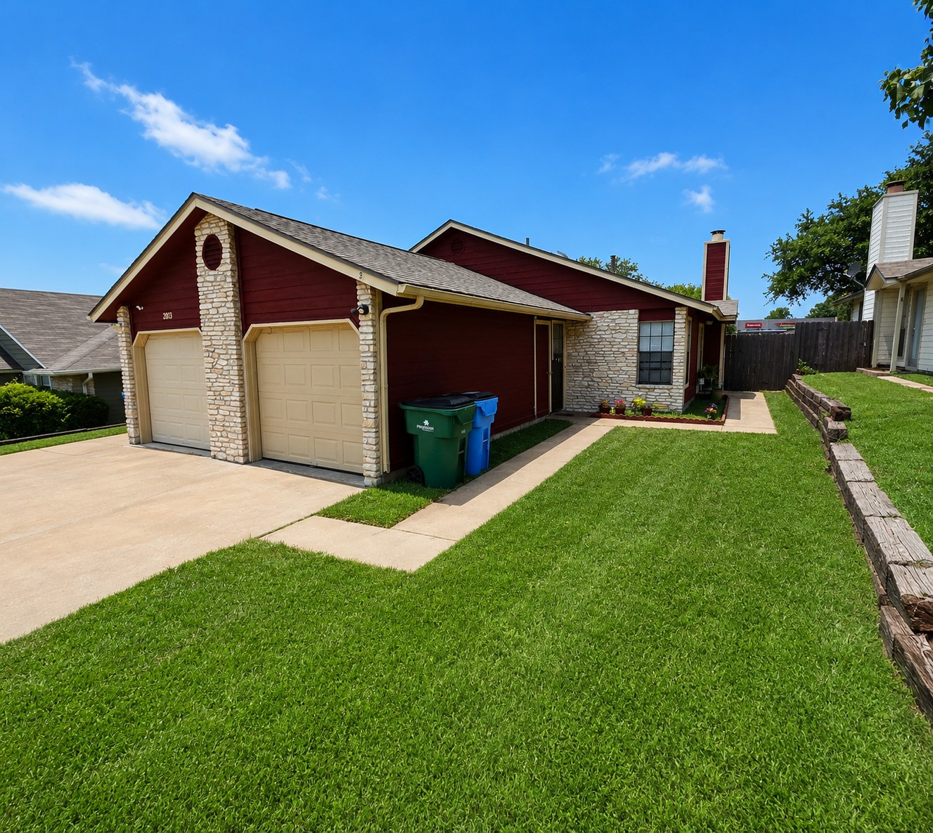 2013 Margalene Way Austin, TX 78728 - Photo 2 of 19 A well-maintained lawn and sturdy stone accents enhance this home's curb appeal.