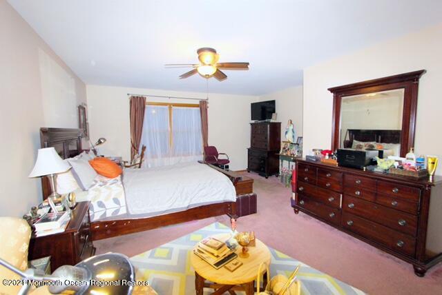766 Anderson Road Jackson, NJ 08527 - Photo 11 of 21 a living room with furniture and a chandelier