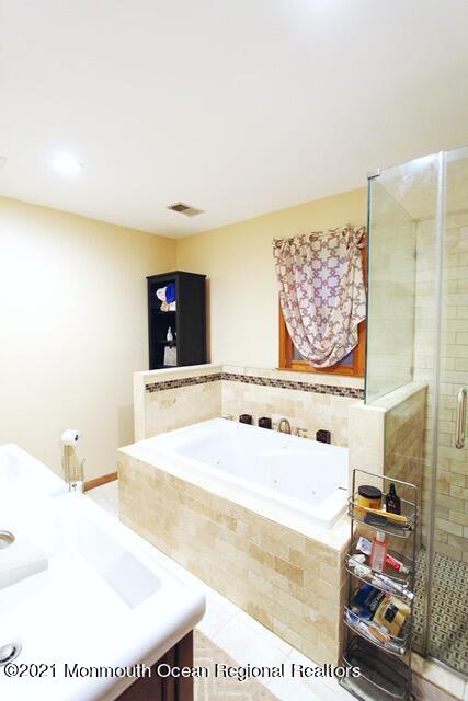 766 Anderson Road Jackson, NJ 08527 - Photo 12 of 21 a bathroom with a bathtub and a sink