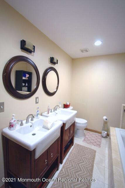 766 Anderson Road Jackson, NJ 08527 - Photo 13 of 21 a bathroom with a sink and a mirror