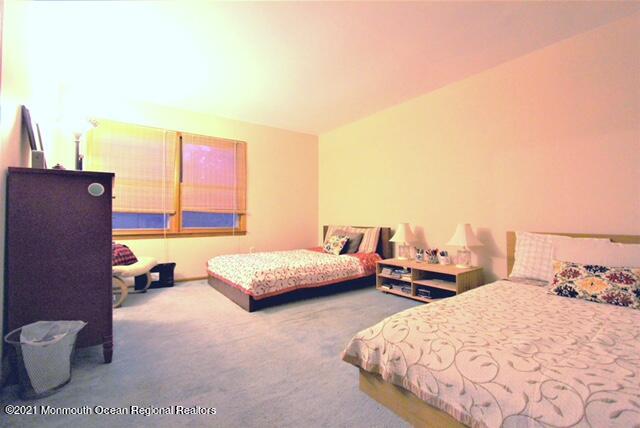 766 Anderson Road Jackson, NJ 08527 - Photo 14 of 21 a bedroom with a bed and wooden floor
