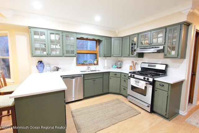 766 Anderson Road Jackson, NJ 08527 - Photo 4 of 21 a kitchen with a sink stove and cabinets