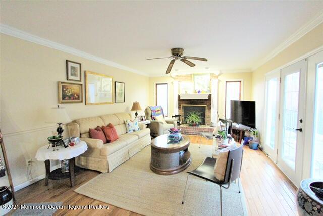 766 Anderson Road Jackson, NJ 08527 - Photo 7 of 21 a living room with fireplace furniture and a flat screen tv