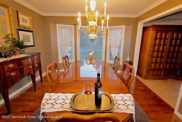 766 Anderson Road Jackson, NJ 08527 - Photo 9 of 21 a living room with furniture and a chandelier