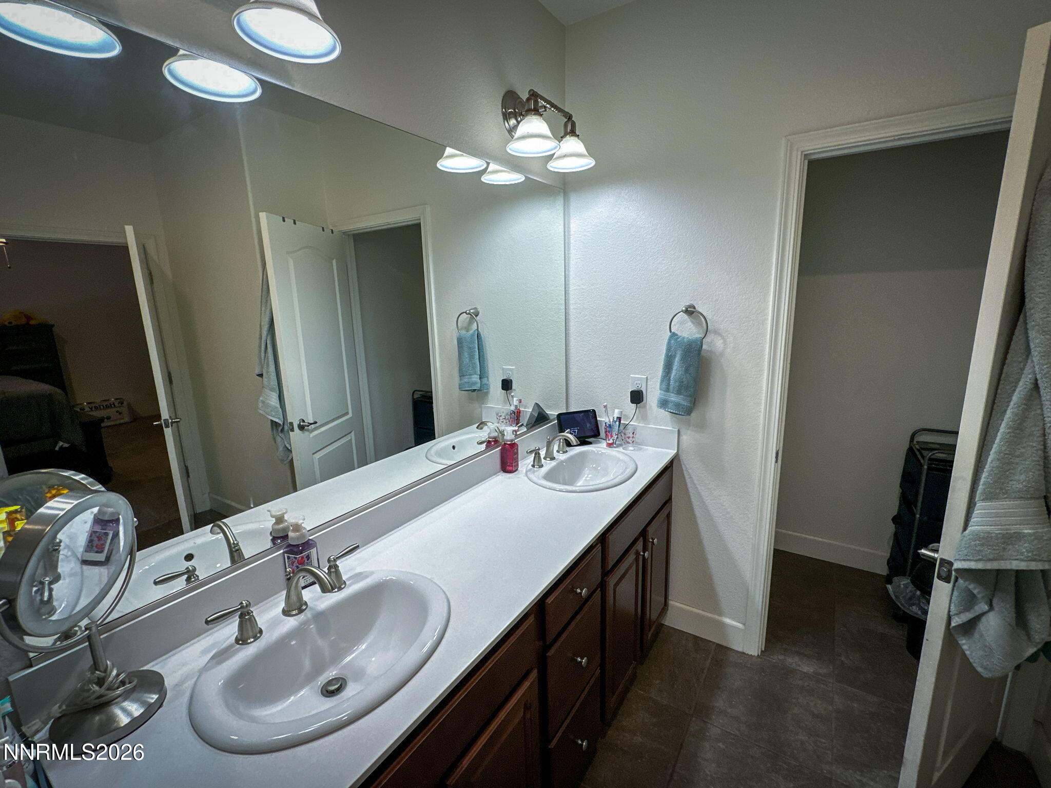 7330 Overture Drive Reno, NV 89506 - Photo 9 of 17 a bathroom with a double vanity sink and a mirror