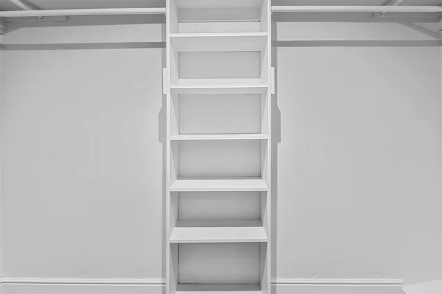 a view of an empty walk in closet