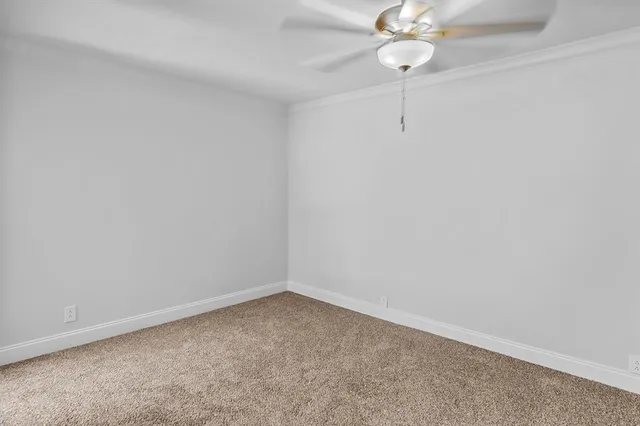 a view of a room with a fan