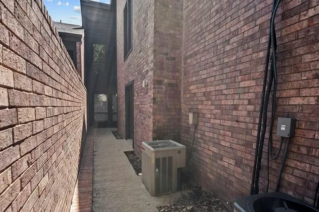 a bathroom with a toilet and shower