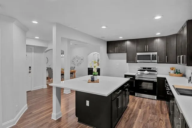 a kitchen with a sink stove and refrigerator
